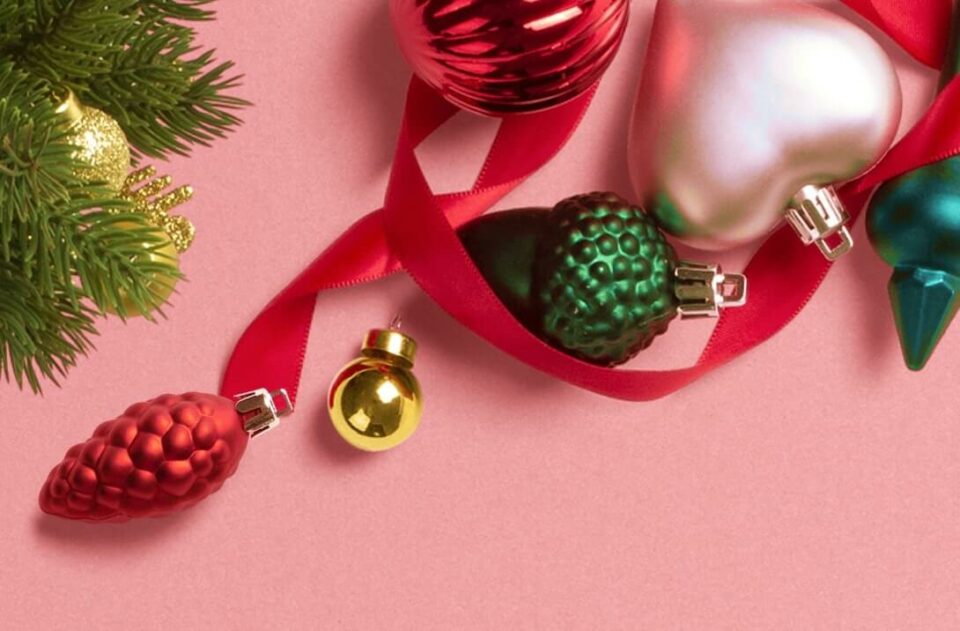 Christmas baubles on a pink background